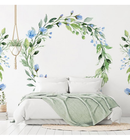 Papier peint - Romantic wreath - plant motif with blue flowers and leaves