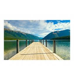 Fotomural - Un puente de un lago montañés