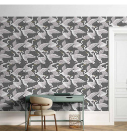 Papel pintado - Flying birds – a delicate pattern of white and grey herons on a grey background