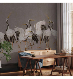 Fototapetas - Crane dance – bright silhouettes of birds against a warm grey background with texture