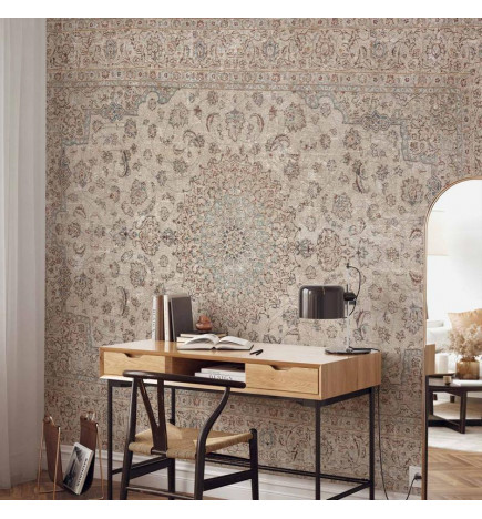 Fotobehang - Sand carpet - worn Persian carpet with rich decorative motifs