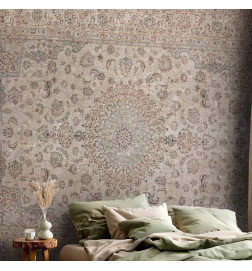 Fototapet - Sand carpet - worn Persian carpet with rich decorative motifs