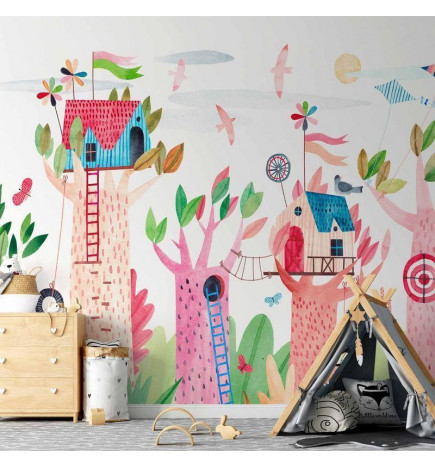 Fotobehang - Painted tree houses - a colourful fantasy with kites for children