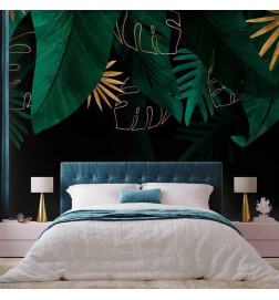 Papier peint - Jungle and composition - motif of green and golden leaves on a black background