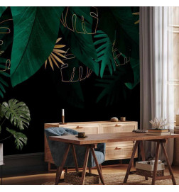 Fototapeta - Jungle and composition - motif of green and golden leaves on a black background