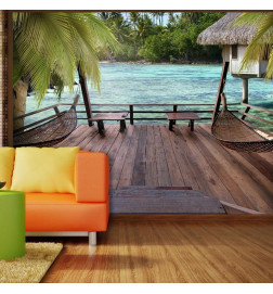34,00 € Fototapetti - Tropical Landscape - Turquoise water with palm trees and wooden cottages